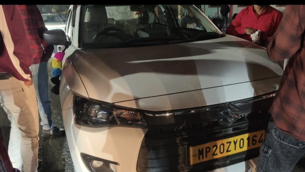 Car hits divider, narrowly averts major accident; bright lights the culprit!